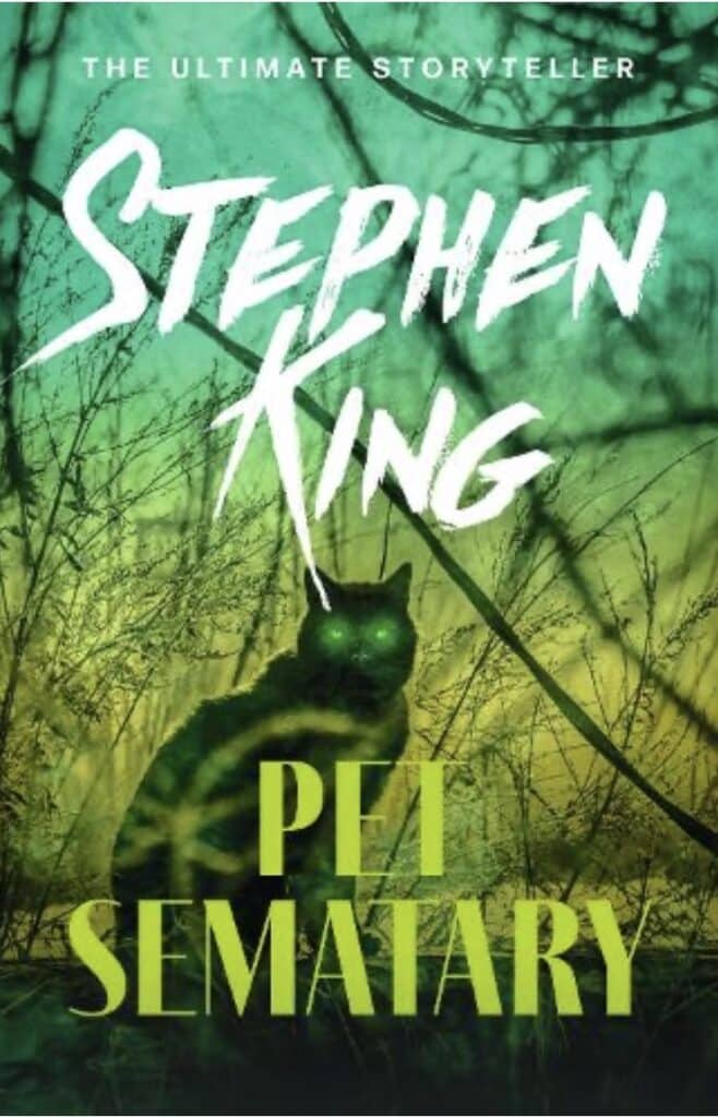 a teal to yellow ombre book cover with a picture of a cat with glowing eyes and the title "pet sematary" written in yellow across the bottom